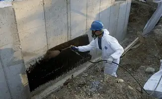 Professional waterproofing the exterior walls of the basement in Charleston, SC