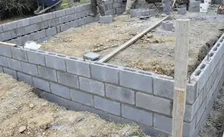 Professionals building a foundation with blocks in Charleston, SC